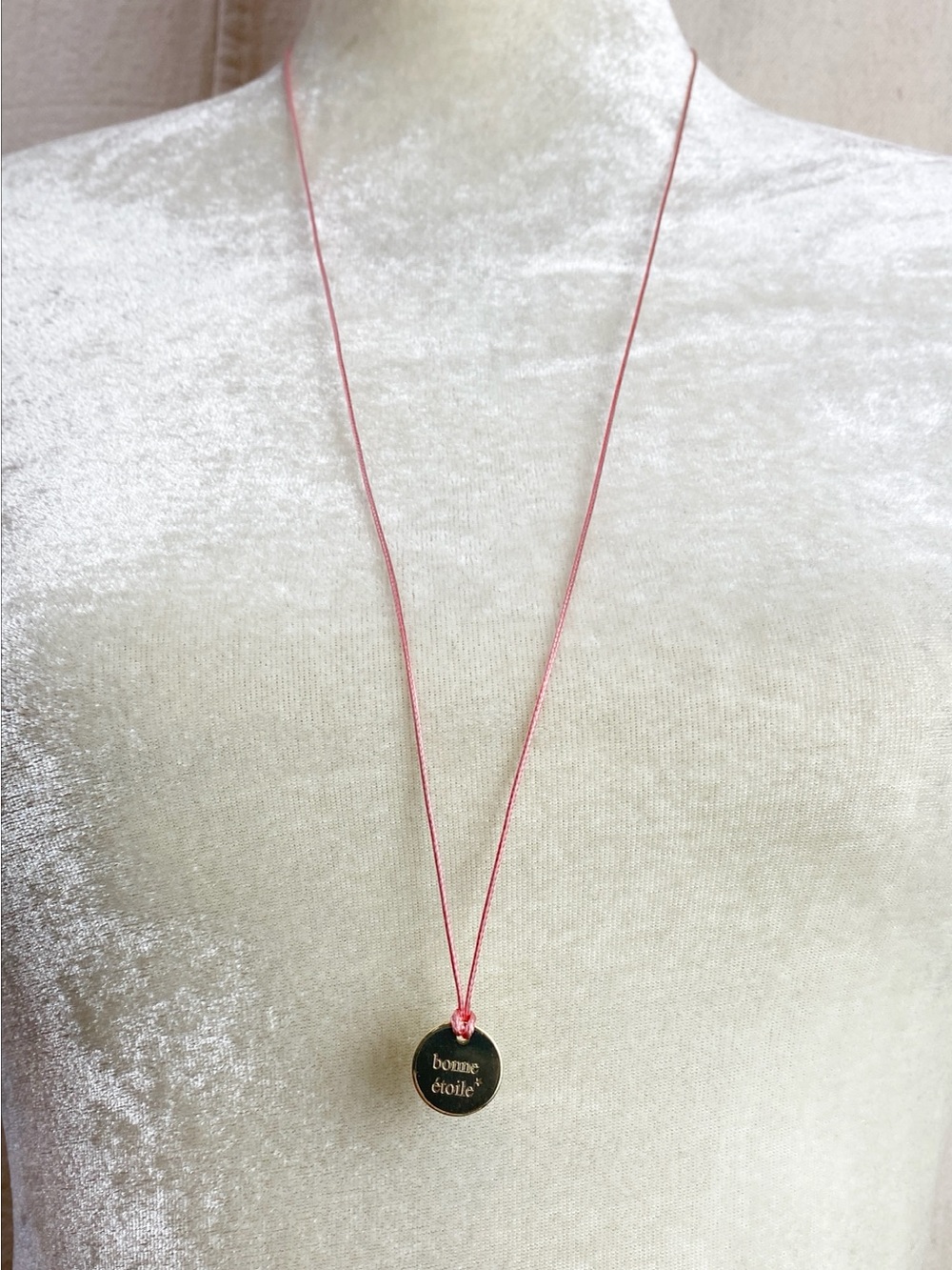 bonne etoile gold tone disc pendant pink cord necklace